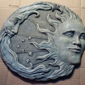 Stone sun and moon wall decor